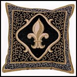 One of the widest known symbols in the world, the fleur de lis is detailed in the subtle shading of black and gold on this throw pillow. 